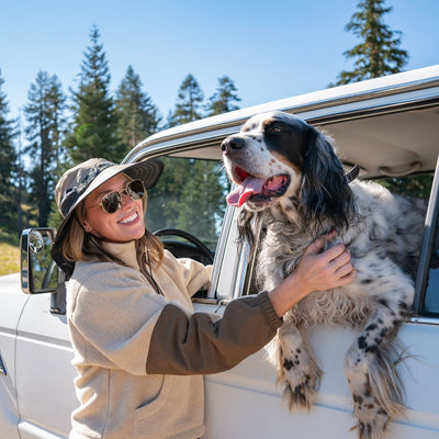Woman with a dog in a car